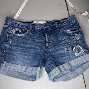 Abercrombie & Fitch Distressed Blue Jean Shorts With Floral Ish Design On Front